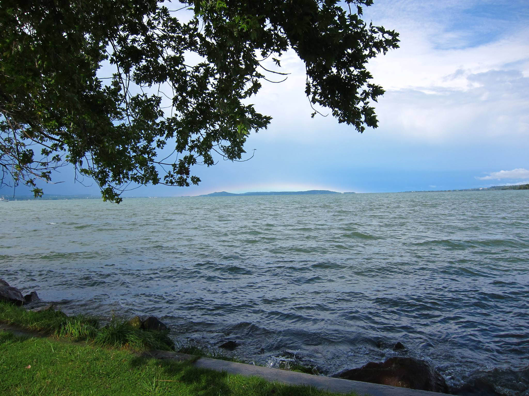 Cristina Apetrei: from the harbour in Balatonszemes, with a small rainbow on the horizon; probably 2014